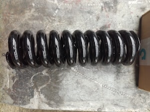 Sprężyna mechanizmu napinającego gąsienicy #RG511-21420